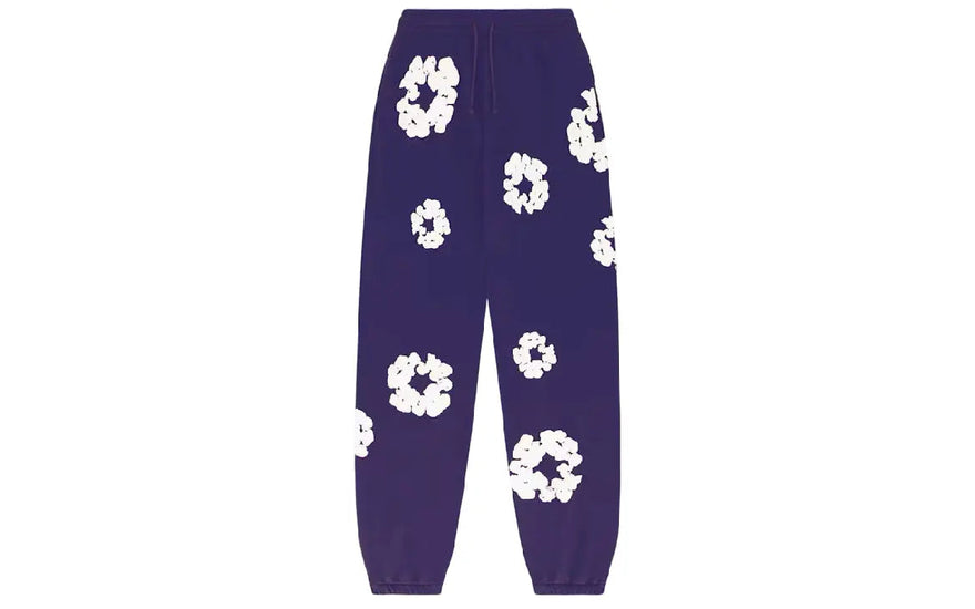 Denim Tears The Cotton Wreath Sweatpants Purple: Vibrant purple trousers and woven art