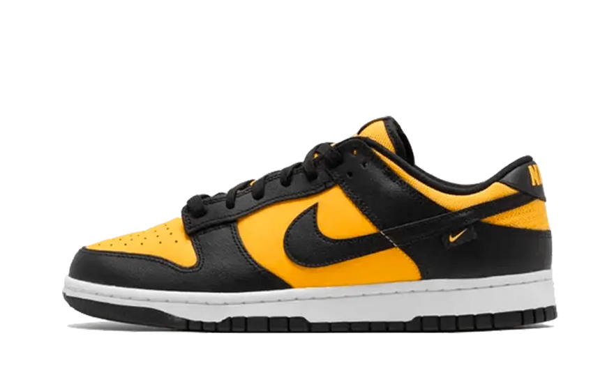 Nike Dunk Low Nero Oro Universitario — Eleganza urbana che spicca