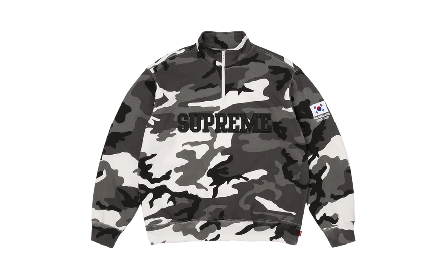 Supreme Shop Flag Half Zip Pullover Snow Camo Seoul: la felpa SS26 que lleva una tienda bordada en la manga